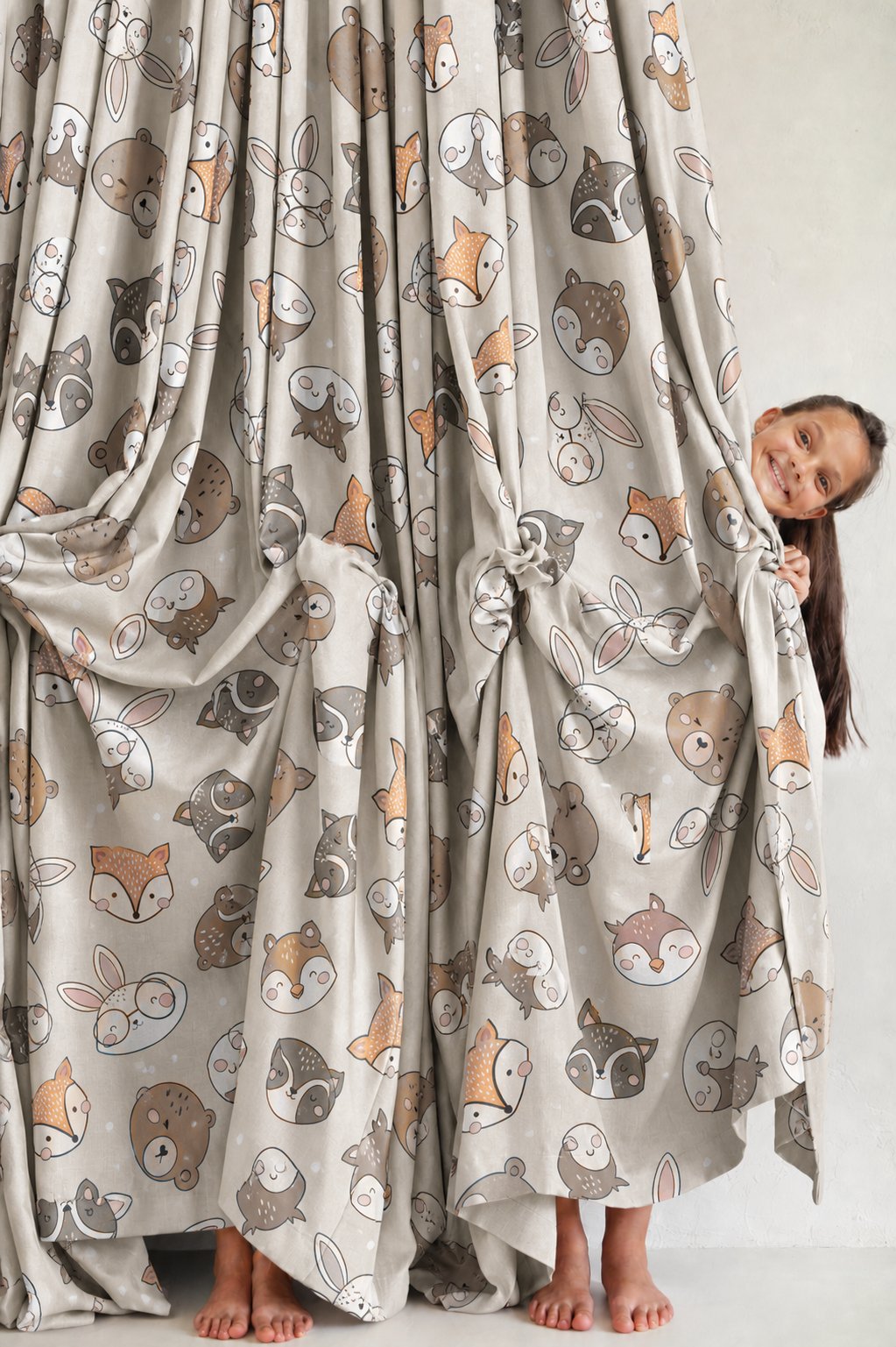 Pair of grey woodland animal kids curtains in a child's bedroom