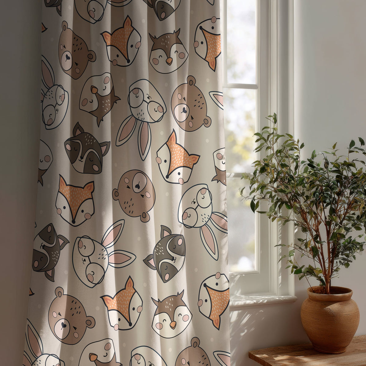 Grey woodland animal kids curtain beside a potted olive tree