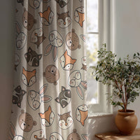 Grey woodland animal kids curtain beside a potted olive tree