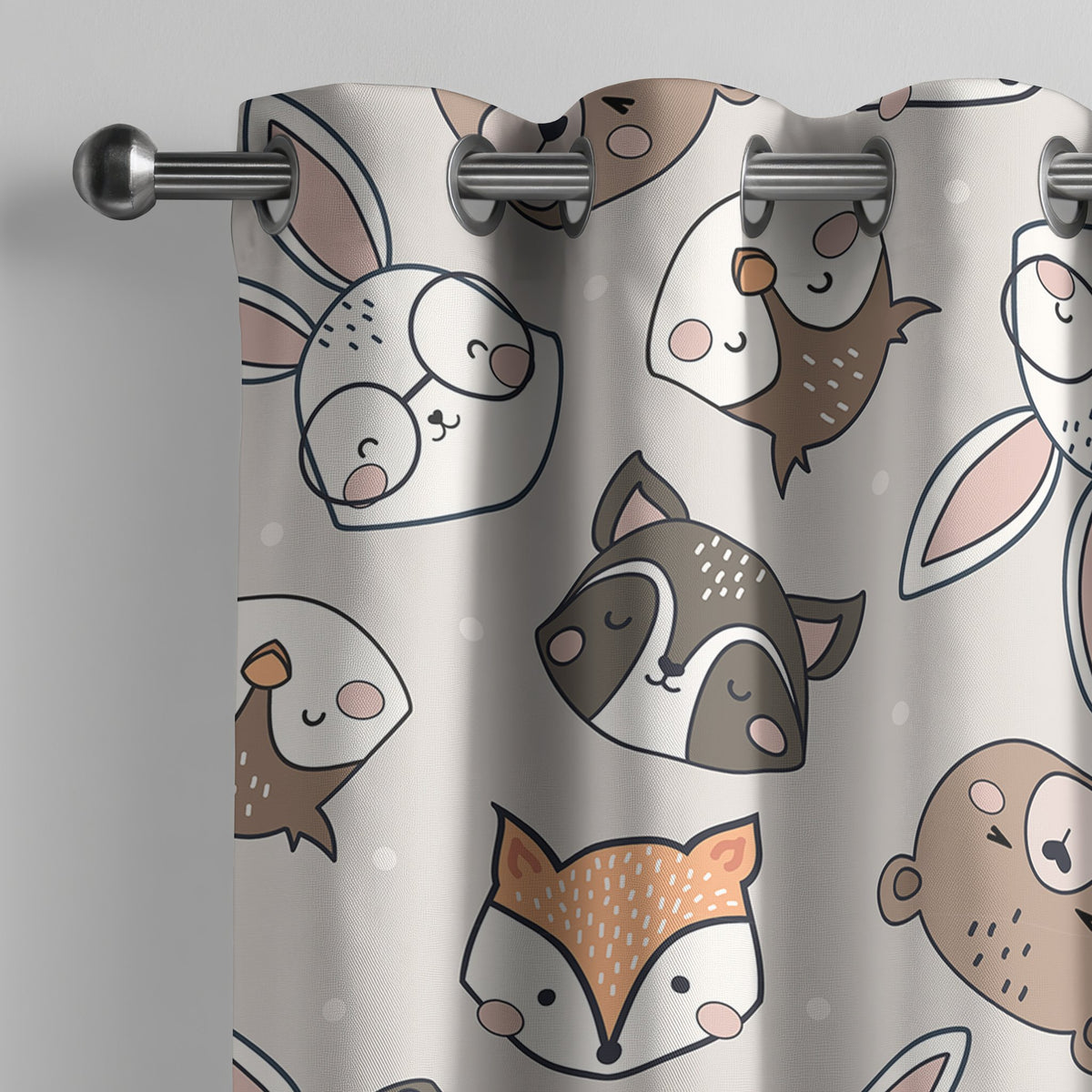 Grey woodland animal kids curtain on a grommet rod, close-up of the print
