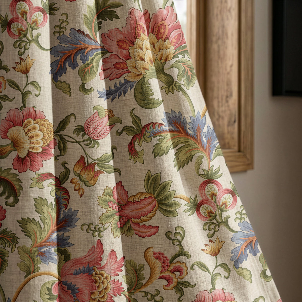 Jacobean floral curtain panel beside a rustic wooden window