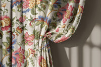 Jacobean floral curtain gathered to one side
