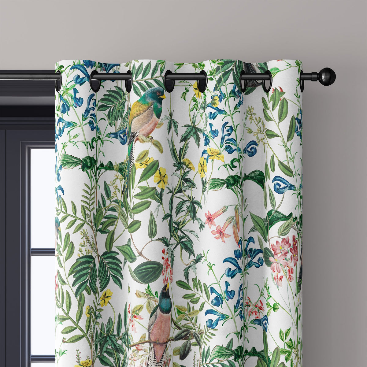 Close-up of jungle botanical floral curtain grommets on a black rod