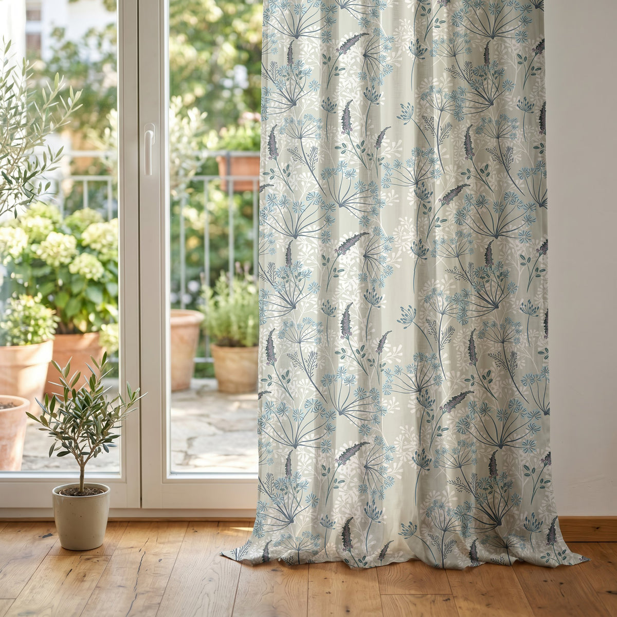 Light blue meadow flower curtain at glass patio doors
