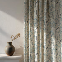 Soft daylight through a light blue meadow flower curtain