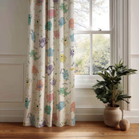 Little monsters kids curtain panel hanging by a white window