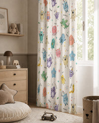 Little monsters kids curtains framing a tall window