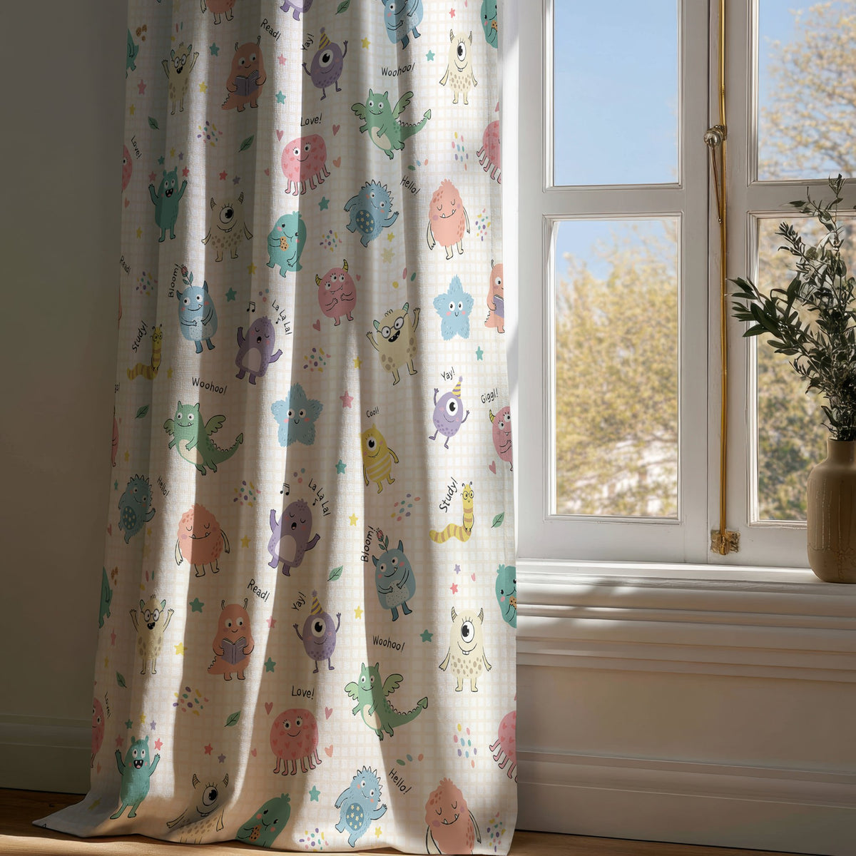 Full-length little monsters kids curtain draping to a wooden floor