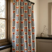 Mid century modern tulip curtains in slate blue and red in a living room