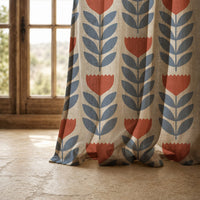 Hem of a mid century tulip curtain on a stone floor
