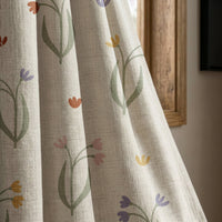 Minimal tulip stem curtain panel beside a rustic wooden window