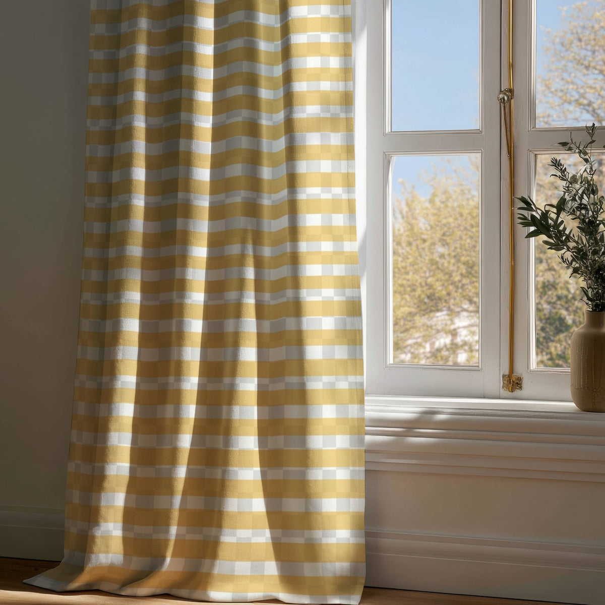 Full-length mustard yellow check curtain draping to a wooden floor