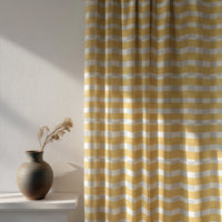 Soft daylight through a mustard yellow check curtain