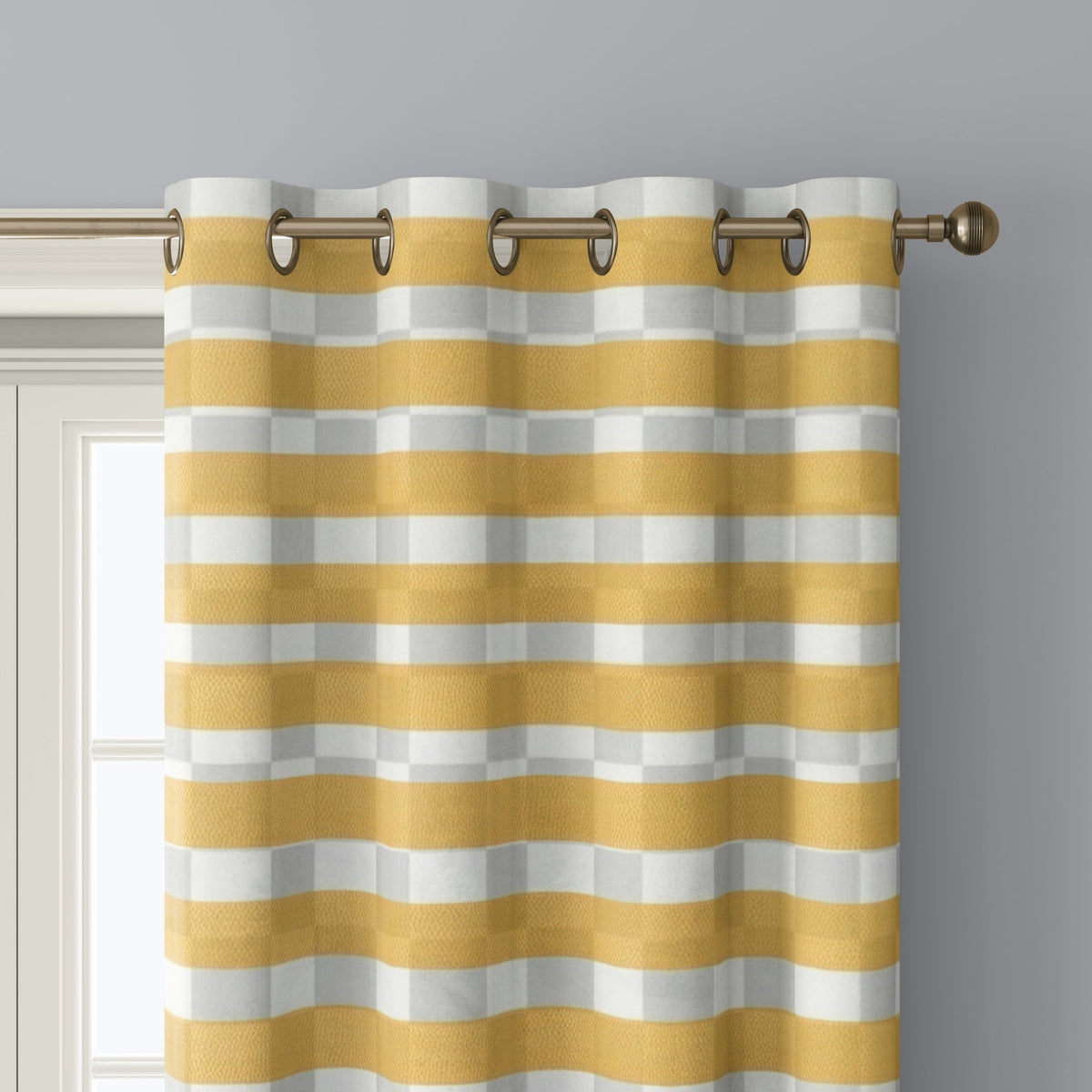Close-up of mustard yellow check curtain grommets on a black rod
