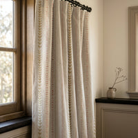 Natural folk ticking stripe curtains in a warm living room