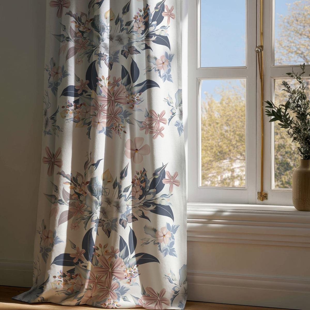 Full-length navy and blush floral curtain draping to a wooden floor