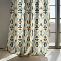 Navy folk diamond curtain panels by a sunny window