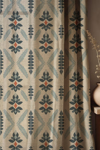 Soft folds of a navy folk diamond curtain