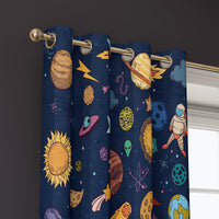 Grommet top of a navy outer space kids curtain on a brass rod