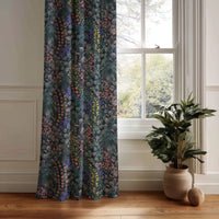 Navy wildflower meadow curtain panel hanging by a white window