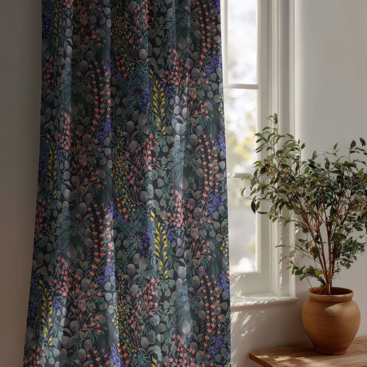 Navy wildflower meadow curtain beside a potted olive tree