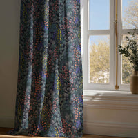 Full-length navy wildflower meadow curtain draping to a wooden floor
