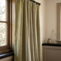 Olive green stripe curtains in a warm living room
