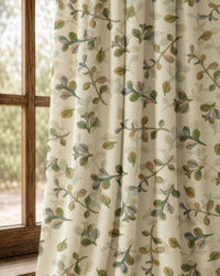 Pair of olive leaf sprig curtains at an arched window