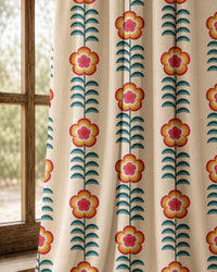 Pair of orange folk flower stripe curtains at an arched window