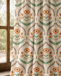 Pair of orange ogee floral curtains at an arched window