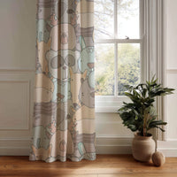 Pastel animal nursery curtain panel hanging by a white window