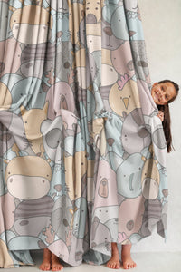 Pair of pastel animal nursery curtains in a child's bedroom