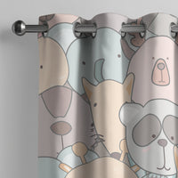Pastel animal nursery curtain on a grommet rod, close-up of the print