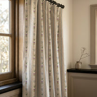 Pastel ditsy floral stripe curtains in a warm living room