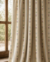 Pair of pastel ditsy floral stripe curtains at an arched window