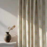 Soft daylight through a pastel kite nursery curtain