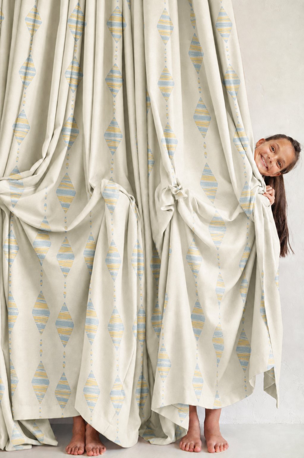 Pair of pastel kite nursery curtains in a child's bedroom