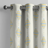 Pastel kite nursery curtain on a grommet rod, close-up of the print