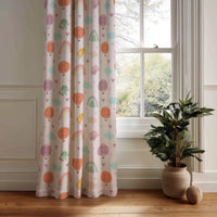 Pastel rainbow kids curtain panel hanging by a white window