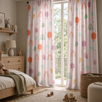 Pair of pastel rainbow kids curtains in a child's bedroom