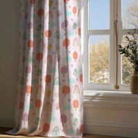 Full-length pastel rainbow kids curtain draping to a wooden floor