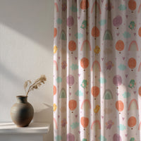 Soft daylight through a pastel rainbow kids curtain