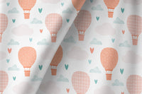 Peach hot air balloon nursery curtains framing a tall window