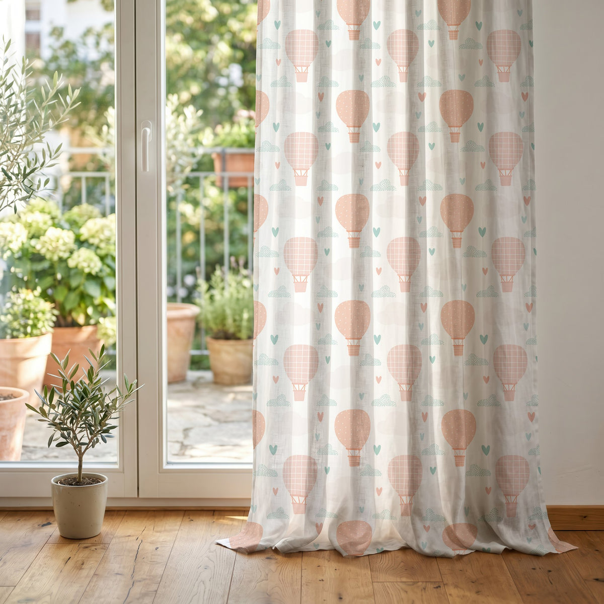 Peach hot air balloon nursery curtain at glass patio doors