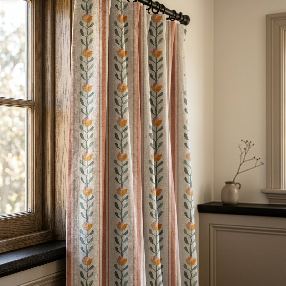 Pink and blue folk vine stripe curtains in a warm living room