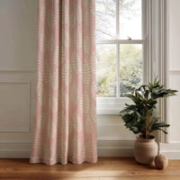 Pink fern leaf nursery curtain panel hanging by a white window
