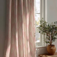 Pink fern leaf nursery curtain beside a potted olive tree