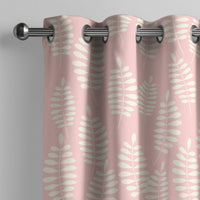 Pink fern leaf nursery curtain on a grommet rod, close-up of the print