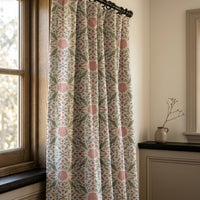 Pink folk medallion curtains in a warm living room