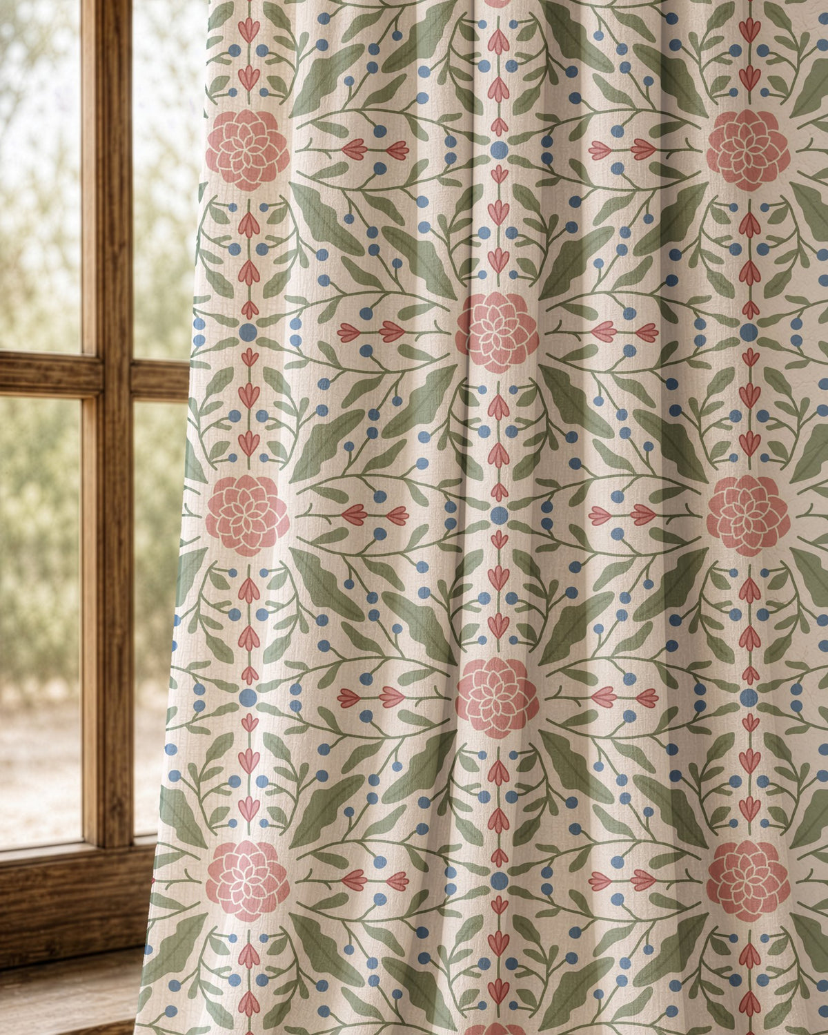 Pair of pink folk medallion curtains at an arched window